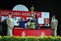 Bill Casner (WinStar Farm) hoists the Dubai World Cup as presented by Sheikh Mohammed bin Rashid Al Maktoum, Vice-President of the UAE and Ruler of Dubai