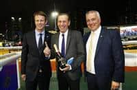 The Hong Kong Jockey Club’s Executive Director, Racing Authority, Mr. Andrew Harding (left) and Executive Director, Racing Business and Operations, Mr. Anthony Kelly (right), present a commemorative bottle of champagne to trainer John Size (centre), celebrating his 1000th Hong Kong win with Game Of Fun.