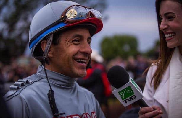 Triple Crown winning jockey Victor Espinoza waves to the crowd before  throwing out the ceremonial first pitch before the baseball game between  the Arizona Diamondbacks and San Diego Padres in a baseball